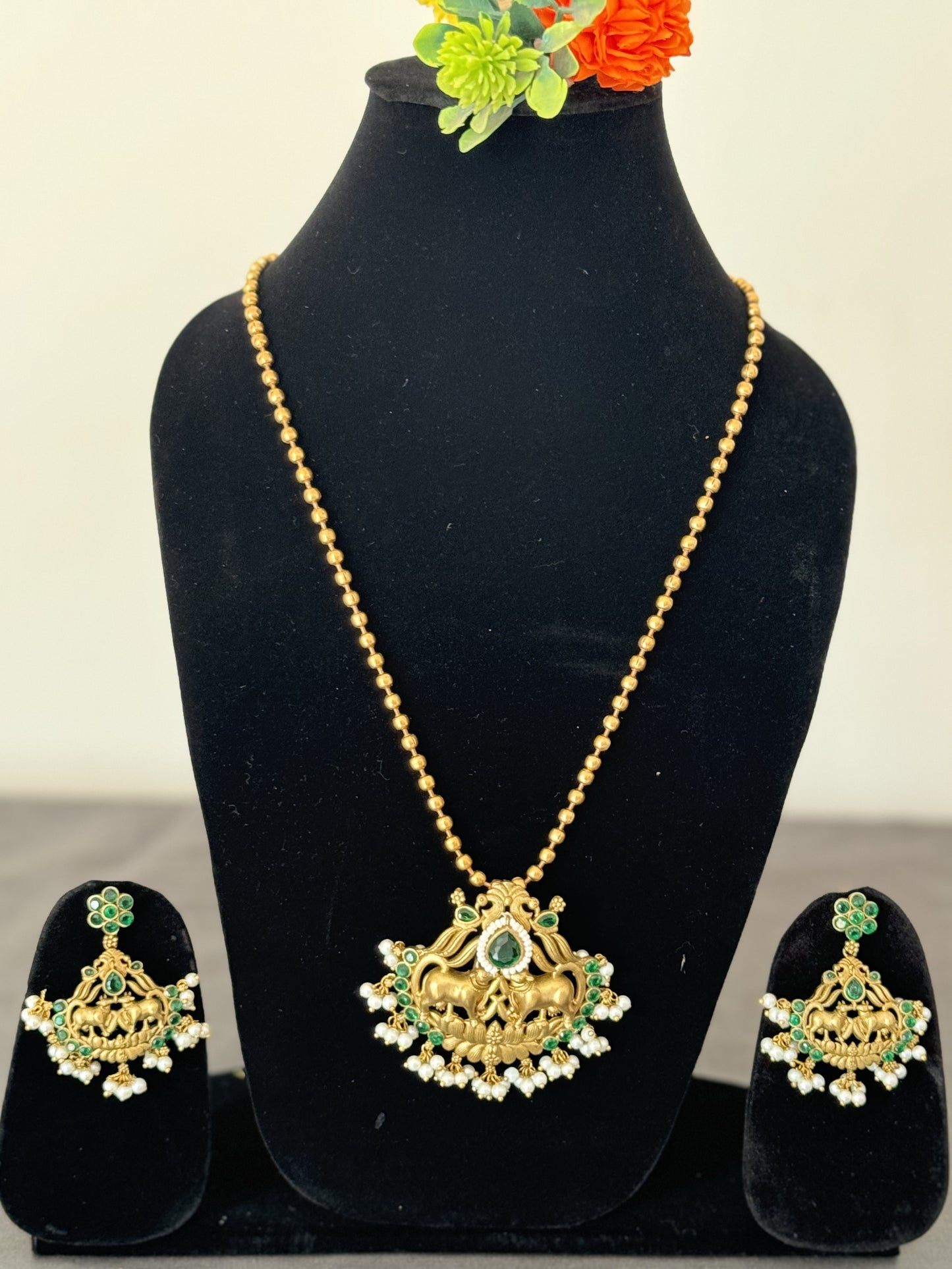 semi-precious emerald embedded with white beads long chain golden pendant set for women with earrings
