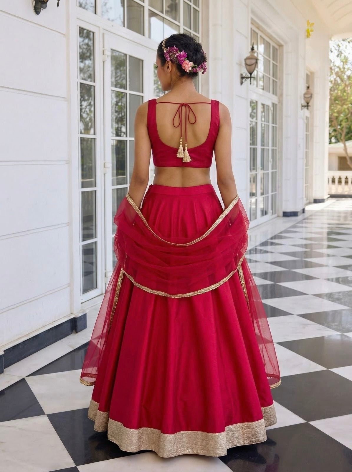 fuchsia pink silk light-weight lehenga set with hand-embroidered v-neck blouse and net dupatta