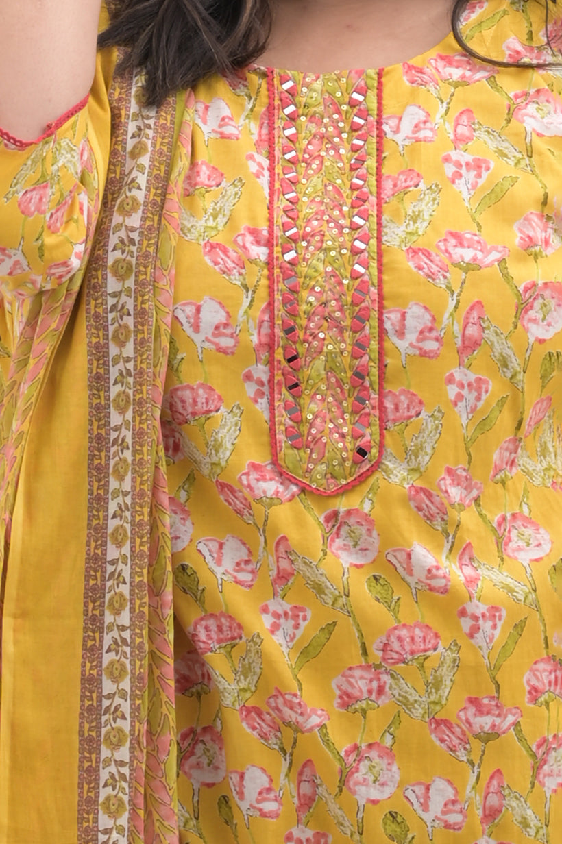 yellow with pink highlights, mirror work on net, cotton floral print  suit set