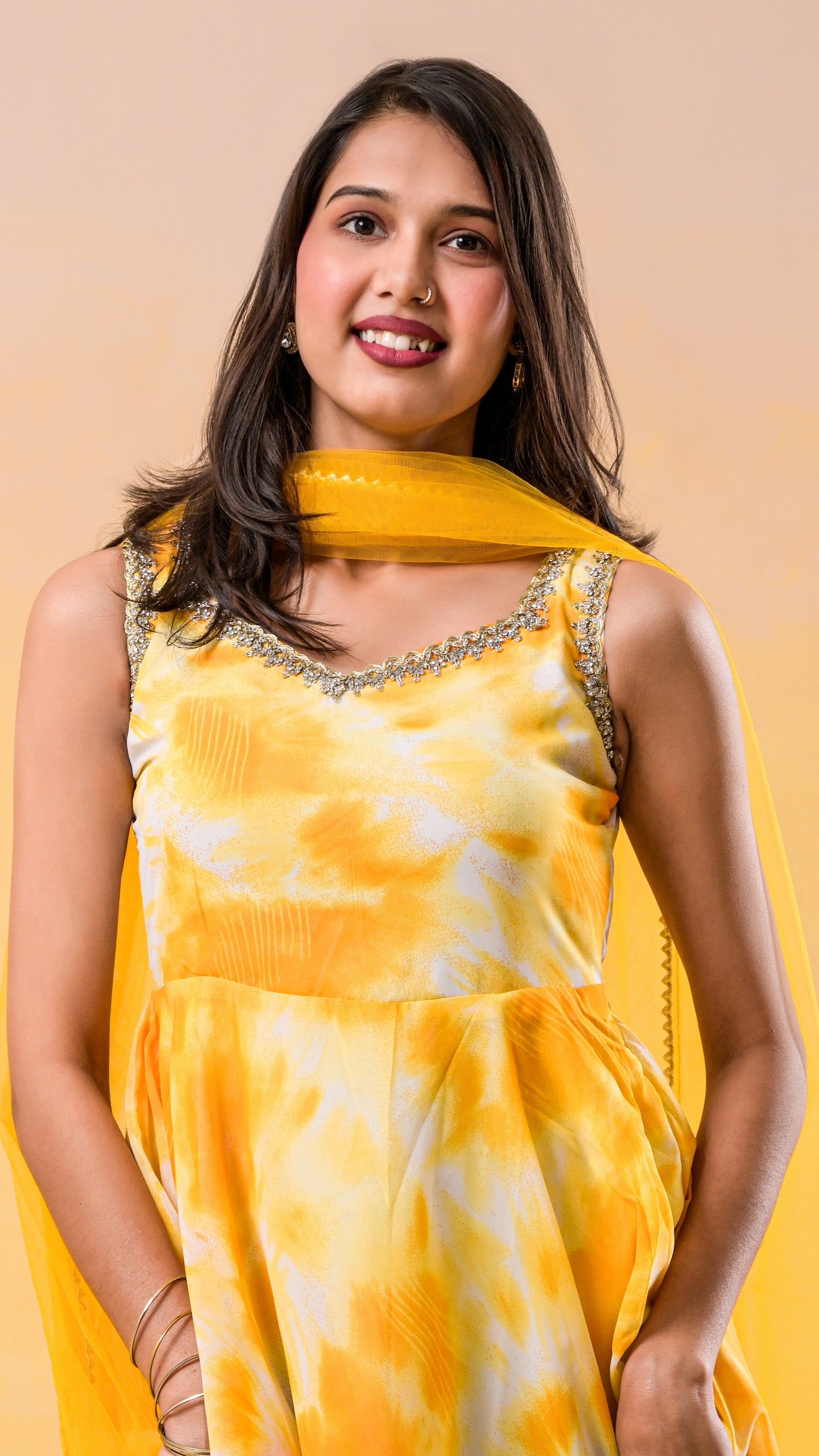 yellow and white tie-dye print georgette gown with net dupatta