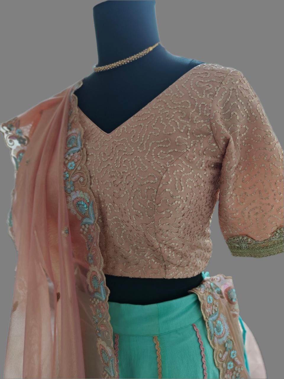 powder blue lehnga with peachish pink blouse and dupatta