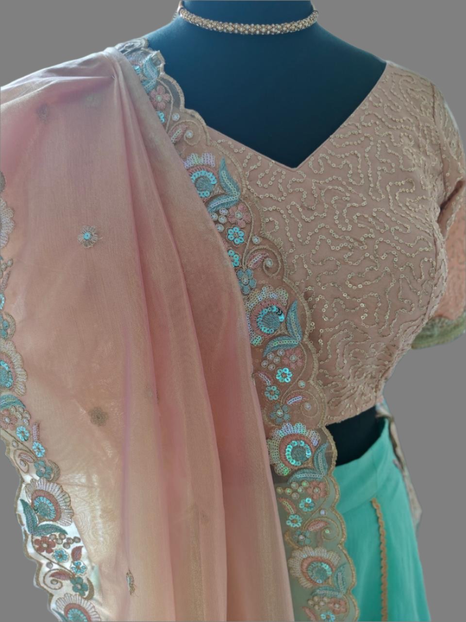 powder blue lehnga with peachish pink blouse and dupatta