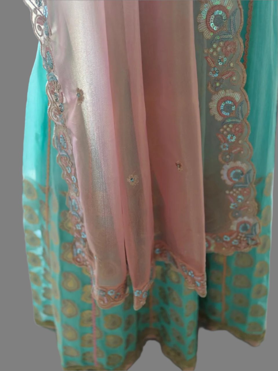 powder blue lehnga with peachish pink blouse and dupatta