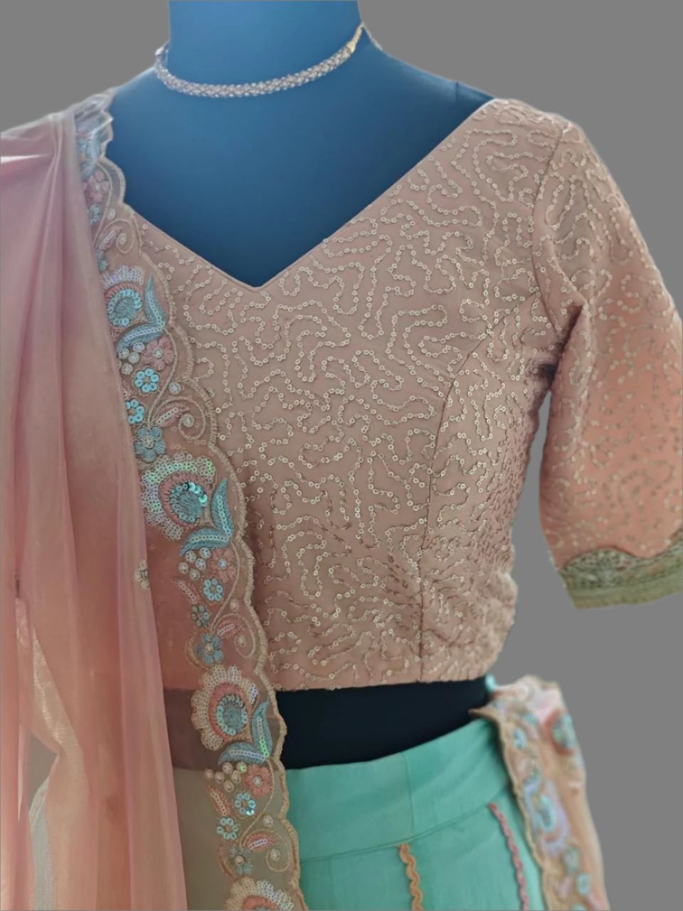 powder blue lehnga with peachish pink blouse and dupatta