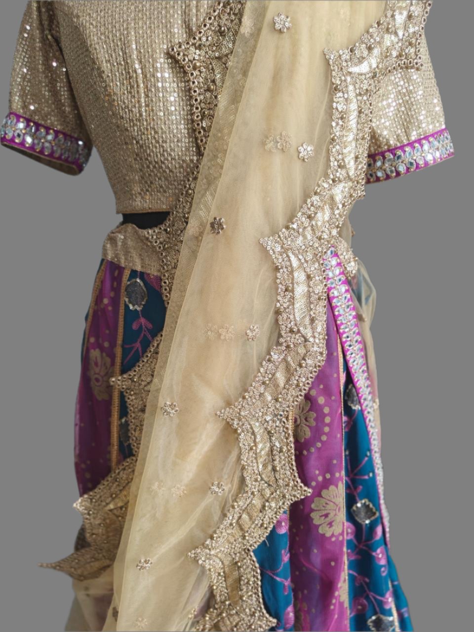 blue-pink lehnga with golden embroidered blouse and net dupatta