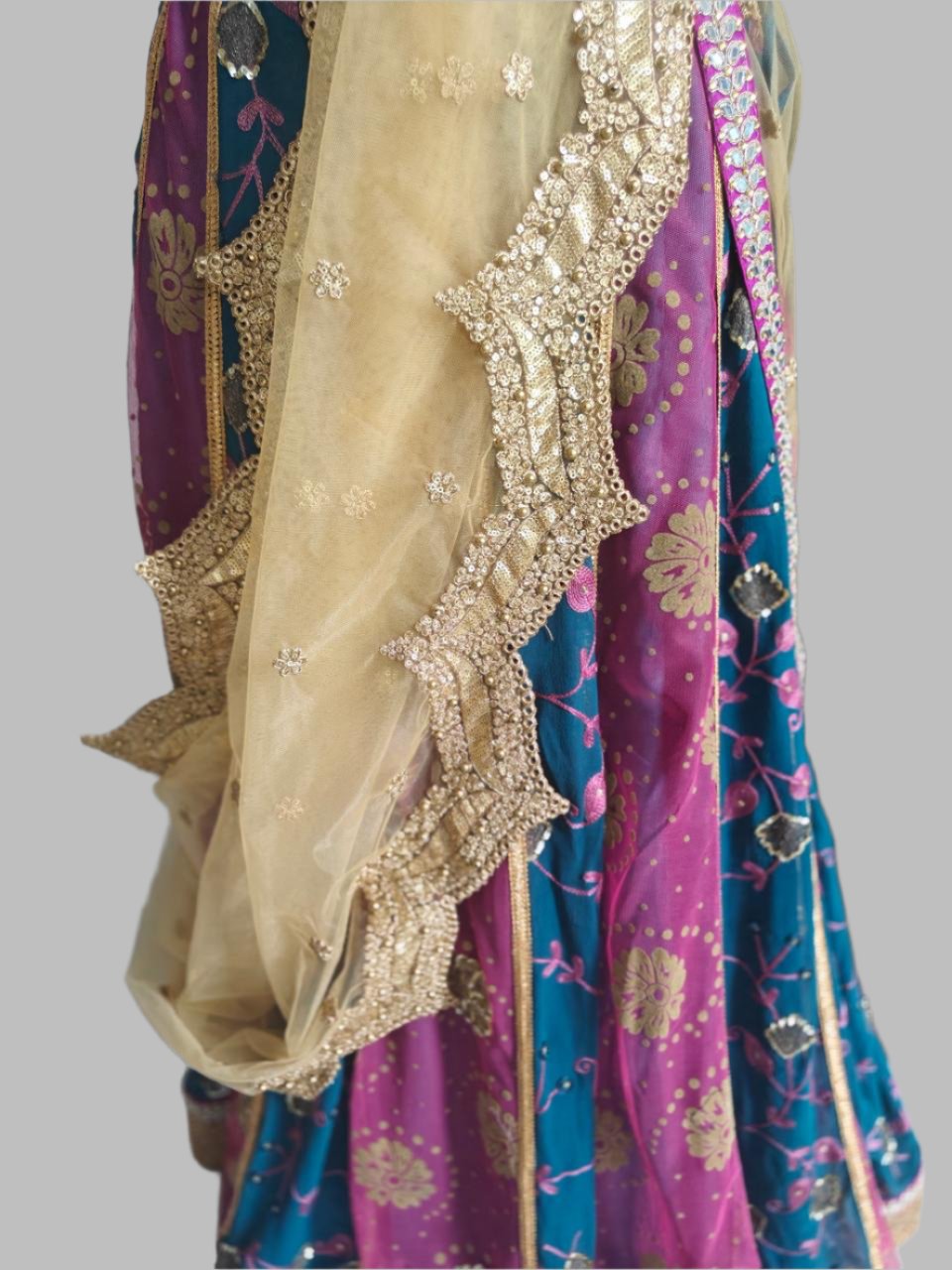 blue-pink lehnga with golden embroidered blouse and net dupatta