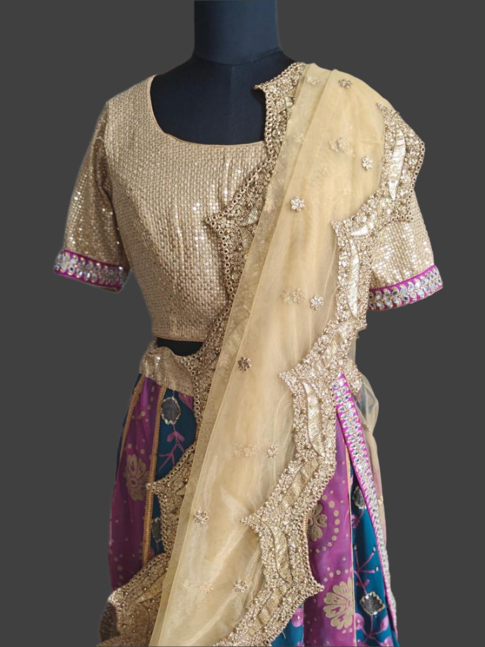 blue-pink lehnga with golden embroidered blouse and net dupatta