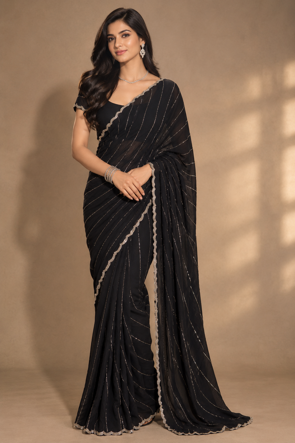 black satin saree with delicate metallic stripes & scalloped border with stitched blouse and petticoat
